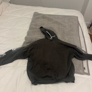 Charcoal sweatshirt with sequins on sleeves.